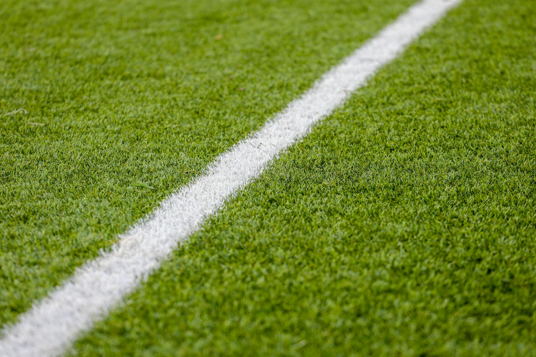 close up of a sports field with white line marking